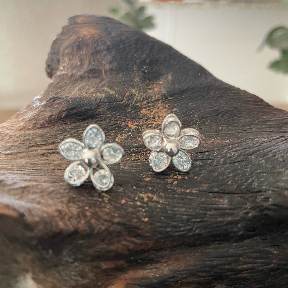 Small CZ flower shaped post earrings silver color